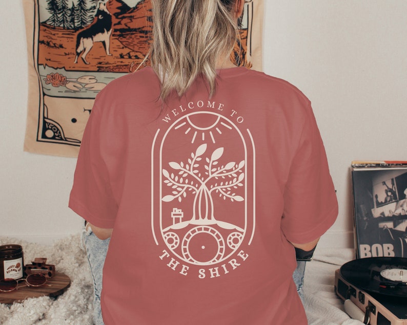 Welcome to the Shire Shirt back view in the color Mauve