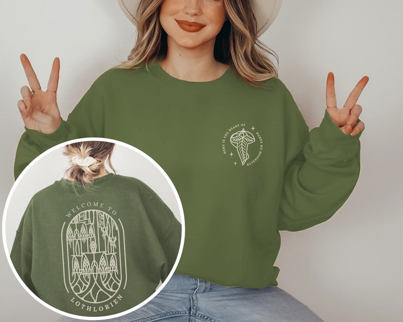 May include: Green sweatshirt with a white graphic on the front that says "Where is the heart of Elves no longer found?" and a white graphic on the back that says "Welcome to Lothlorien".