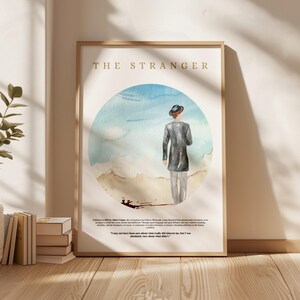 May include: A watercolour illustration of a man in a hat walking away from the viewer. The background is a blue and white watercolour sky with a brown beach. The text "THE STRANGER" is at the top of the image. The text below the image reads "Published in 1942 by Albert Camus, this existential novel follows Meursault, a man detached from emotion and convention, as he navigates a world that shuns his apathy and coldness. Through social language and sparse details, the story explores existentialism, morality, and the boundaries of reason. A contemporary classic, "The Stranger" is a haunting reflection on the human condition."