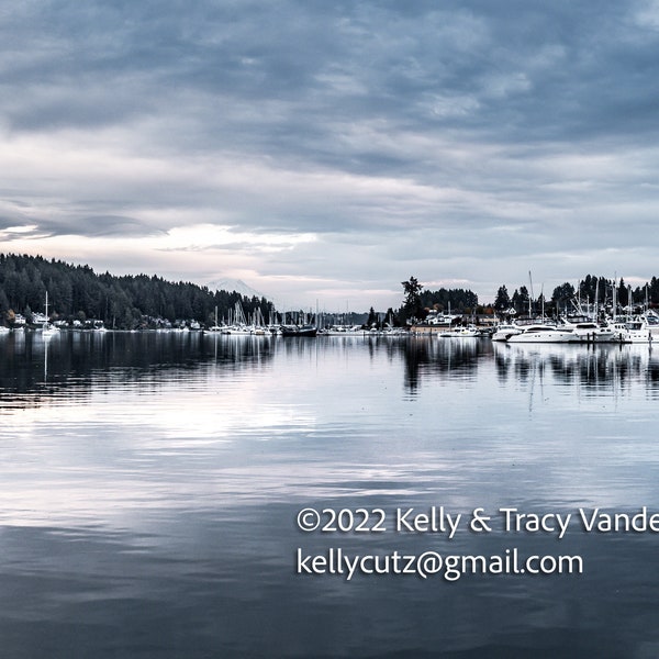 Silvery Gig Harbor waterscape view looking at cloudy Mt. Rainier