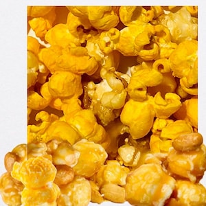 May include: Close-up of caramel popcorn. The popcorn is a mix of golden yellow and caramel brown, with a glossy, textured appearance. The image is tightly framed, filling the space with the snack.