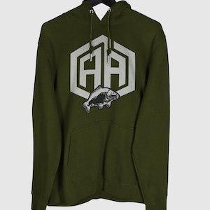 May include: A dark green hooded sweatshirt with a white hexagonal logo featuring the letters "AA" and a black and white fish graphic.