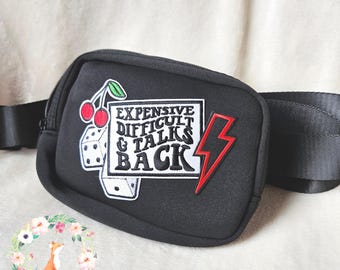 Riñonera moderna con parches, cara, difícil de manejar y que responde.