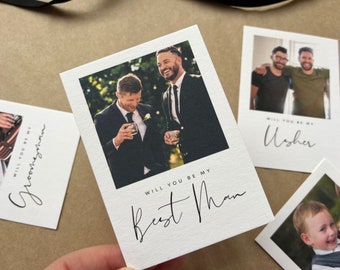 May include: White cards with photos and text, perfect for wedding proposals. One card says "Will you be my Best Man" with a photo of two men in suits. Other cards say "Groomsman" and "Usher".
