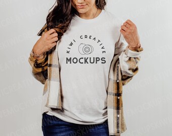 May include: White t-shirt with a black and white graphic of two kiwi fruit and the text "Kiwi Creative Mockups".
