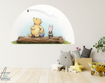 May include: Winnie the Pooh and Piglet are sitting on a log, with a bee flying overhead. The characters are drawn in a cartoon style and are looking up at the bee. The background is a light blue sky with clouds.