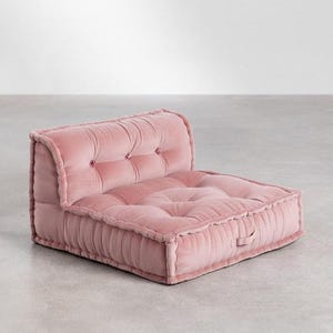 May include: A white ceramic mug with a black handle and the text "But First, Coffee" in a black, bold font. The mug is on a white surface. The mug is approximately 10 cm tall.