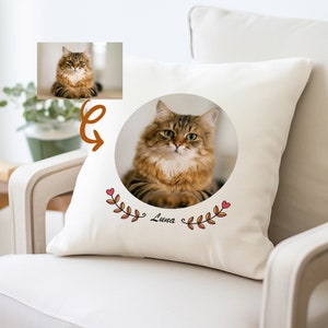 May include: A white pillow with a brown cat photo in a circle, surrounded by red hearts and orange leaves. The text "Luna" is written below the photo.