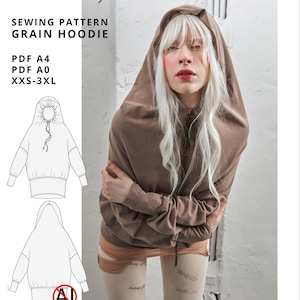 Pode incluir: Um moletom marrom com capuz e mangas compridas, apresentado como um molde de costura digital. O texto diz NOIZ:27, digital download, Made in Italy, SEWING PATTERN GRAIN HOODIE, PDF A4, PDF A0, XXS-3XL, e for designers & advanced hobby sewists.