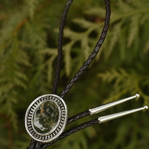 Oval Ajax Turquoise Bolo Tie With Curb Chain Border Sterling Silver