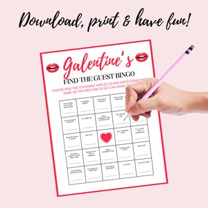 May include: A pink and white printable Galentine's Day bingo card with the text "Find the Guest Bingo". The card has a grid of 25 squares with different statements about guests. The card is being marked with a pink pencil.