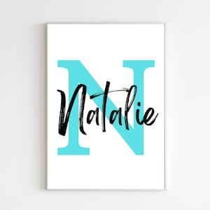 May include: A white printable art print with a large turquoise letter N and the name Natalie written in black cursive script.