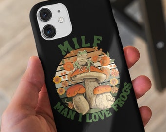 May include: Black phone case with a retro-style graphic of a frog sitting on a mushroom. The text "MILF MAN I LOVE FROGS" is printed on the case.