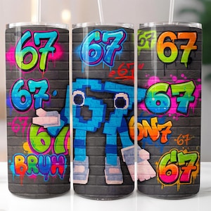 May include: Three stainless steel tumblers with a graffiti-style design. The design features the number "67" in various colours, including green, pink, and orange, set against a grey brick wall background. The word "BRUH" is also visible.