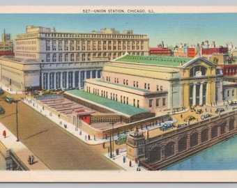 May include: Vintage postcard featuring Union Station in Chicago, Illinois. The image shows a large building with columns, a green roof, and a bridge with cars. The sky is blue, and the buildings are in shades of beige, white, and red.