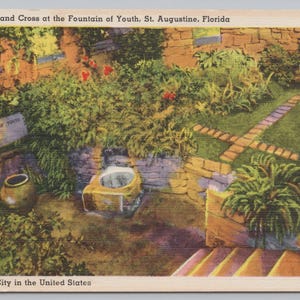 May include: Vintage postcard featuring a colorful view of the Fountain of Youth in St. Augustine, Florida. The image shows a stone cross, lush greenery, and a sign that reads "The Fountain of Youth". The text "The Oldest City in the United States" is also visible.