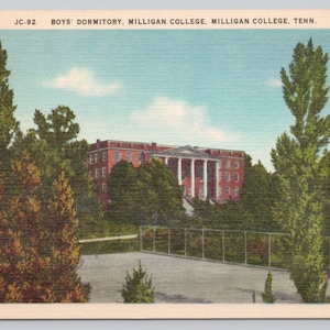 May include: Vintage postcard of the Boys' Dormitory at Milligan College, Tennessee. The red brick building with white columns is surrounded by trees. The sky is blue with a few clouds. The postcard has the text "JC-92" and "E-7917".