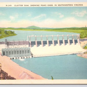 May include: A vintage postcard showing Claytor Dam in Southwestern Virginia. The dam is a concrete structure with multiple gates and a large reservoir behind it. The postcard also shows Peaks Knob in the distance.