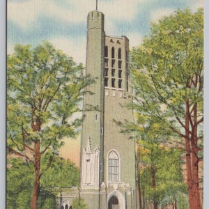 May include: Vintage postcard featuring the Memorial Bell Tower in Valley Forge, Pennsylvania. The tower is a tall, light green structure with a series of arched windows and a spire. Lush green trees frame the tower against a blue sky.