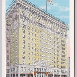 May include: A vintage postcard illustration of the Hotel Radisson in Minneapolis, Minnesota. The tall, yellow building features ornate architectural details, a flag with the text RADISSON, and several vintage automobiles on the street below.