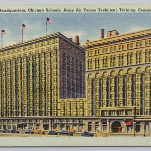 May include: A vintage postcard featuring the Unit No. 2 Headquarters, Chicago Schools, Army Air Forces Technical Training Command. The image shows a large, multi-story tan building with many windows, American flags on the roof, and vintage cars.