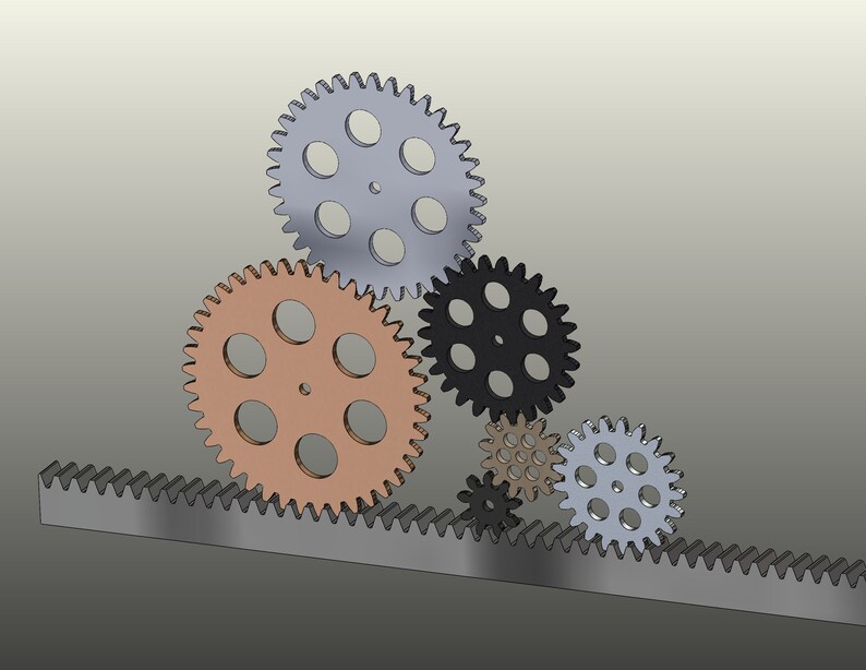 May include: A set of five gears, including a rack gear, in various sizes and colours. The gears are made of metal and have a silver, black, copper, and grey finish.
