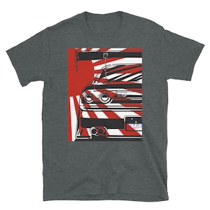 May include: Dark gray t-shirt featuring a graphic of a sports car's rear, set against a red and white backdrop. The design includes the car's taillights, spoiler, and exhaust pipes. The license plate reads "POD Apparel".