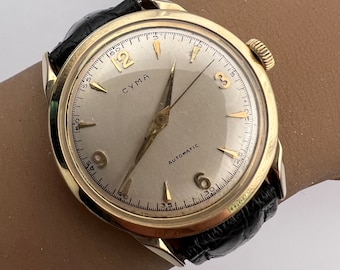c. 1950 14k Gold Fine Collectible Mid-Century Cyma Swiss Automatic Dress Watch. Included is a Free 400 Dollar Service & Restoration