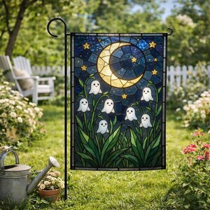 May include: A rectangular garden flag featuring a stained glass style design of a yellow crescent moon and stars against a dark blue night sky, with six small white ghosts emerging from green leafy plants, suspended on a black metal stand.
