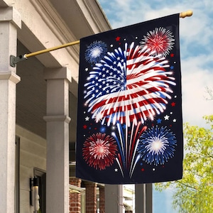 May include: A black outdoor flag featuring a stylized American flag design with fireworks. The flag's central image is a burst of red and white stripes and blue stars, with additional red and blue fireworks.