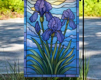 May include: A garden flag featuring a stained-glass design of purple iris flowers against a blue sky background. The flag has a rectangular shape and is displayed on a black metal stand. The iris flowers have green stems and leaves.