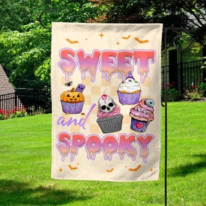 May include: A Halloween garden flag with the words "Sweet and Spooky" in dripping, colorful letters. The flag features illustrations of cupcakes decorated with spooky themes, including a pumpkin, skull, and eyeball.