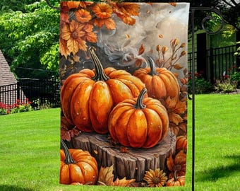 May include: A decorative garden flag featuring a vibrant autumn scene. The flag showcases several orange pumpkins on a wooden stump, surrounded by fall foliage in shades of orange and brown. The background has a smoky effect.