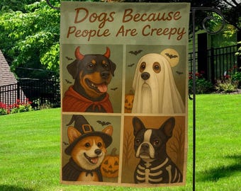 May include: A Halloween garden flag featuring four dog portraits in costumes. The text "Dogs Because People Are Creepy" is at the top. The dogs are dressed as a devil, ghost, witch, and skeleton. The flag is hanging on a black metal stand in a grassy yard.
