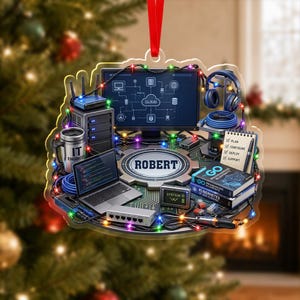 May include: A flat, circular ornament featuring a computer setup with a monitor displaying a cloud network diagram, a laptop with code, a server tower, headphones, a mug labeled IT ENGINEER, books, and a gear center with the name ROBERT.