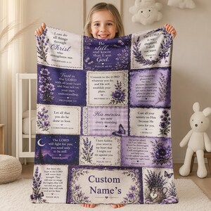 May include: A rectangular throw blanket featuring a patchwork design with purple and white sections. Each square displays floral lavender illustrations, butterflies, and various Bible verses. The bottom center section includes the text Custom Name's.