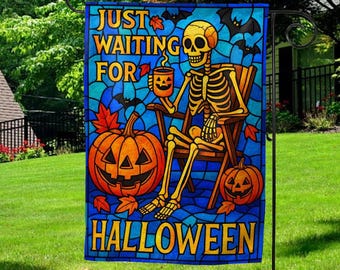 May include: A Halloween garden flag with a stained-glass design. It features a skeleton in a chair holding a mug with a jack-o'-lantern face. The flag reads "JUST WAITING FOR HALLOWEEN" with pumpkins and bats.