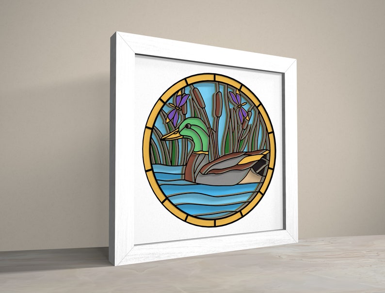May include: A stained glass style illustration of a green duck swimming in blue water with green reeds and purple flowers.