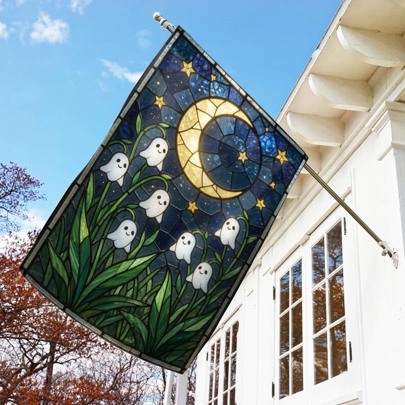 May include: A rectangular garden flag featuring a stained glass style design of a crescent moon and yellow stars against a dark blue night sky, with white ghost figures emerging from green lily of the valley flowers in the foreground.