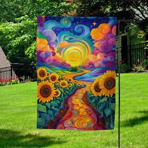 May include: A garden flag with a psychedelic design featuring a winding path lined with sunflowers leading to a swirling sun in the sky. The background is a vibrant blue with swirling clouds in shades of purple, pink, and orange.