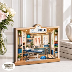 May include: A miniature 3D diorama of a physical therapy clinic labeled Dr. Harper Physical Therapy Clinic. The scene features a treatment table, a rolling stool, exercise balls, resistance bands, dumbbells, a kettlebell, and anatomical charts.