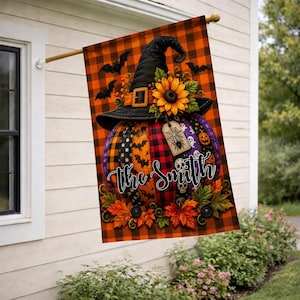 May include: A rectangular garden flag featuring an orange and black buffalo plaid background. A large pumpkin decorated with various patterns, a black witch hat, a sunflower, and autumn leaves is centered with the text The Smith in white script.
