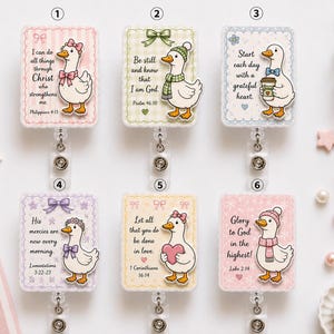 May include: Six rectangular badge reels featuring illustrations of white ducks with various accessories and religious text. Each badge reel has a scalloped border and a retractable cord mechanism. The designs include ducks with bows, scarves, hats, and hearts.