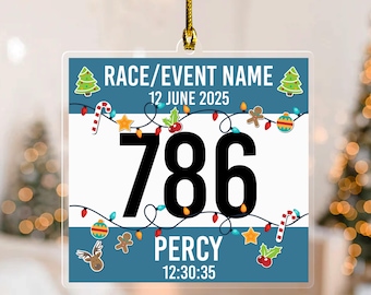 May include: A clear, square Christmas ornament with a gold string. The ornament features a race bib design with the number 786 in large black font. Text includes "RACE/EVENT NAME", "12 JUNE 2025", "PERCY", and "12:30:35". Festive decorations surround the text.