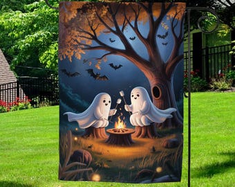 May include: A Halloween garden flag featuring two cartoon ghosts roasting marshmallows over a campfire. The flag has a nighttime forest scene with bats, a large tree, and a full moon. The flag is made of a durable material and is designed for outdoor use.