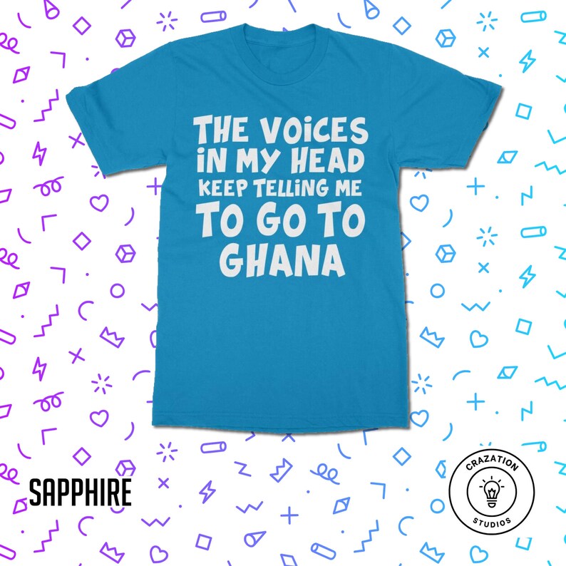May include: A turquoise blue t-shirt with white text that reads "THE VOICES IN MY HEAD KEEP TELLING ME TO GO TO GHANA".