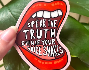 May include: A red and pink sticker with a cartoon mouth open, saying "Speak the truth even if your voice shakes."