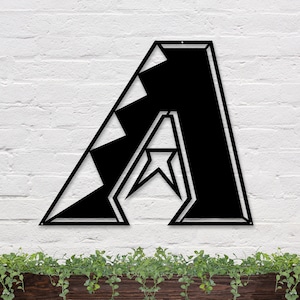 May include: Black metal wall art in the shape of the letter "A" with a star inside. The "A" has a checkered pattern on the left side.