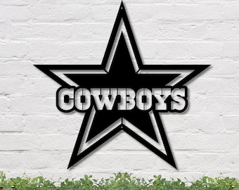May include: Black metal cutout of a five-pointed star with the word "COWBOYS" in the center. The star has a white outline.