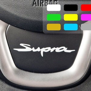 2x Supra MK5 steering wheel stickers in different colors